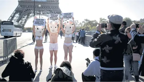  ??  ?? Activists from Peta demonstrat­e in protest of designers’ use of fur, during Paris Fashion Week, in front of the Eiffel Tower.