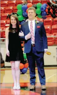  ??  ?? King candidate Jacob Freeman, son of Clay and Angela Freeman, escorted by Katelyn Cunningham, daughter of Ryan Cunningham and Alanna Cunningham.