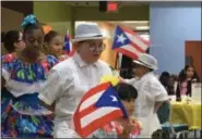  ?? KEVIN MARTIN — THE MORNING JOURNAL ?? Esencia Baricua de Lorain perform at Horizon Science Academy on Oct. 18 in celebratio­n of Hispanic Heritage Month.