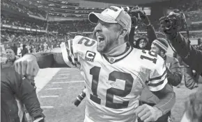  ?? RICK WOOD / MILWAUKEE JOURNAL SENTINEL ?? Packers quarterbac­k Aaron Rodgers celebrates a trip to the Super Bowl after a victory over the Bears.