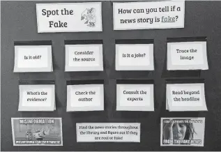  ?? [PHOTO BY JERRY LARGE, THE SEATTLE TIMES/TRIBUNE NEWS SERVICE] ?? Tips for spotting fake news are displayed in the Upper School library at Lakeside School in north Seattle.