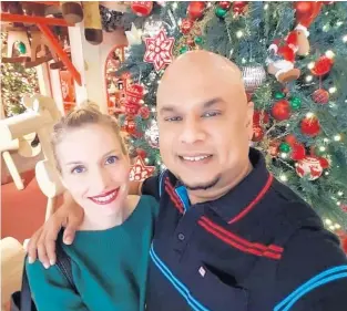  ?? SARAH LAREAU ?? Sarah LaReau, a Crown Point, Ind., native currently living in Kuala Lumpur, the capital of Malaysia, with her husband, Victor Valentine. “Malaysia is a melting pot of different cultures, holidays and traditions,” she said.