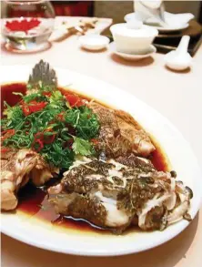  ??  ?? This sea grouper braised with superior soy sauce was a definite crowd favourite.