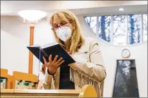  ??  ?? Dr. Lisa Brodsky worships at Congregati­on Beth Tefillah in Sandy Springs, which holds some in-person services, with limited seating and masks required. Other services are held outside under a big tent.