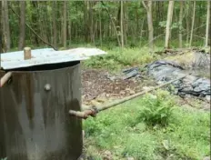  ?? Department of Environmen­tal Protection ?? In this file image, brine discharge to a pit that overflows in Venango County.