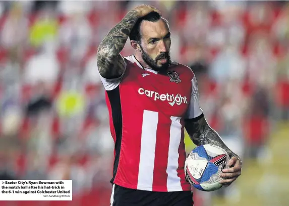  ?? Tom Sandberg/PPAUK ?? Exeter City’s Ryan Bowman with the match ball after his hat-trick in the 6-1 win against Colchester United