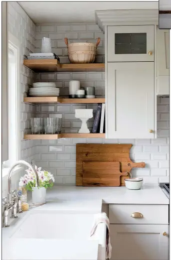  ?? The Washington Post/Jessica White Photograph­y ?? Studio McGee suggests adding dimension to standard subway tile by using ceramic tile with a beveled edge, such as Ice White Beveled Subway Tile from Mission Stone & Tile.