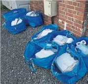  ?? ?? Bags containing freshly laundered linen and galley towels ready to be taken aboard.