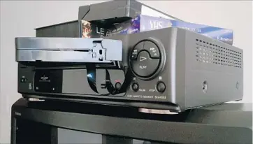  ?? Henri Leduc Moment Editorial/Getty Images ?? FUNAI ELECTRIC, the last Japanese maker of VCRs, will end production this month. The videocasse­tte recorder was a tech turning-point, enabling home viewing of films that otherwise had to be seen at theaters.