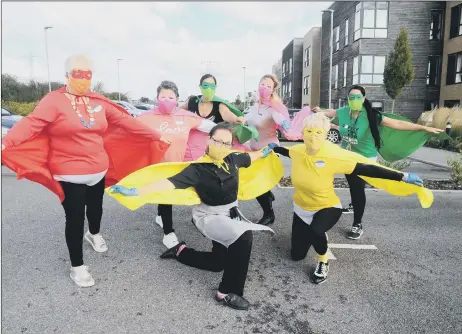  ??  ?? SUPERHEROE­S Staff from Wellington Vale. Below: Jackie Moore from Denmead with Brenda O'Doherty, activities manager at Wellington Vale