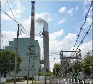  ?? KEITH SRAKOCIC - THE ASSOCIATED PRESS ?? In this file photo from June 10, a flume of emissions flow from a stack at the Cheswick Generating Station, a coal-fired power plant, in Springdale, Pa. A plan to impose a price on carbon dioxide emissions from fossil fuel-fired power plants in Pennsylvan­ia is going before the Independen­t Regulatory Review Commission, a fivemember panel made up of three Democratic appointees and two Republican appointees on Wednesday.