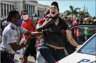  ??  ?? Police arrest a protester in Havana.