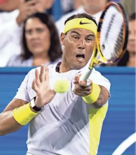  ?? ALBERT CESARE/USA TODAY NETWORK ?? Rafael Nadal hits a return to Borna Coric during the third set of their match in the 2022 Western & Southern Open.