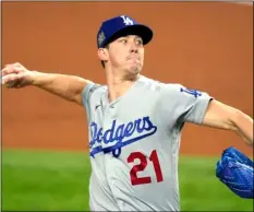  ?? AP Photo/Tony Gutierrez ?? In this 2020 file photo, Los Angeles Dodgers starting pitcher Walker Buehler throws against the Tampa Bay Rays during the first inning in Game 3 of the baseball World Series in Arlington, Texas.