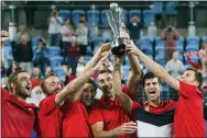  ?? STEVE CHRISTO — THE ASSOCIATED PRESS ?? Serbia players hold up the ATP CUP after defeating Spain during their ATP Cup tennis tournament in Sydney, Monday.