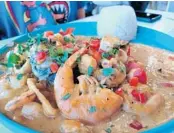  ?? AMY DREW THOMPSON/ORLANDO SENTINEL PHOTOS ?? Picante de mariscos features a variety of seafood.