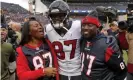  ?? Photograph: David Zalubowski/AP ?? Demaryius Thomas stands with his parents, Bobby Thomas and Katina Smith, during his time with the Houston Texans in 2018.