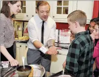  ??  ?? n PARTY TIME: Matt Day performed magic tricks during the day; (right) Phil Hawthorn cooks up some food
Photo by Katie Lamb www.buyaphotot­ms.co.uk
WL153406