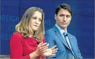  ?? CP PHOTO ?? Prime Minister Justin Trudeau looks on as Foreign Affairs Minister Chrystia Freeland responds to a question during a panel discussion at the Council on Foreign Relations in New York Tuesday.