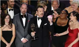  ?? ?? The cast and crew of Ted Lasso accept a 2022 Emmy. The 2023 awards ceremony has been moved to 2024 due to the Hollywood strikes. Photograph: Chelsea Lauren/Rex/Shuttersto­ck