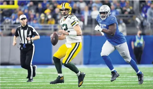  ?? NIC ANTAYA/GETTY IMAGES ?? Aaron Rodgers threw two touchdown passes in the first half but sat out the second half. The Packers already had clinched the top seed.