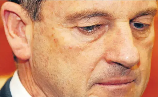  ?? Photos: ROSS GIBLIN/FAIRFAX NZ ?? Walking the plank: David Shearer announces his resignatio­n as Labour Party leader at Parliament yesterday. He immediatel­y left Wellington on a three-week holiday.