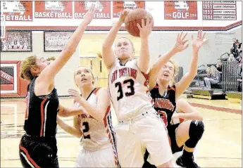  ?? PHOTO BY RICK PECK ?? McDonald County’s Kylie Helm takes the ball to the basket during the Lady Mustangs 47-26 loss to Aurora on Jan. 6 at MCHS.