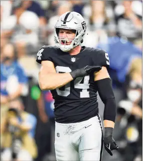  ?? Chris Unger / TNS ?? Defensive end Carl Nassib of the Las Vegas Raiders reacts after making a tackle for a loss of yardage during the second quarter against the Baltimore Ravens at Allegiant Stadium on Monday in Las Vegas. The Raiders won 33-27 in overtime.