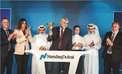  ??  ?? ● Bank Hapoalim’s delegation of senior Israeli businesspe­ople, led by Dov Kotler, rings the bell to begin the day’s trading at NASDAQ Dubai. The delegation was welcomed by the exchange’s CEO, Hamed Ali and the CEO of Dubai Financial Market, Hassan Abdulrahma­n Al Serkal