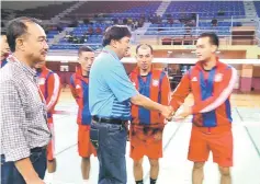  ??  ?? Abang Khalid shaking hands with the players before the start of the match.