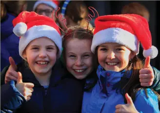  ??  ?? Eve Skelton, Pearl Sweetman and Charlotte Flegg were among members of the choir of Kildare Place National School singing at the launch of the annual Black Santa Sit-Out at St Ann’s Church, Dawson Street, Dublin. Photo: Collins