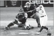  ?? AP/SUE OGROCKI ?? Houston Astros’ Jose Altuve hits a two-run walk-off to win Game 6 of the American League Championsh­ip Series against the New York Yankees on Saturday in Houston.