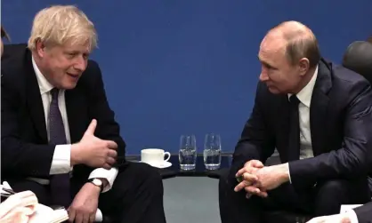  ?? Photograph: Alexei Nikolsky/SPUTNIK/KREMLIN/EPA ?? Boris Johnson meets Russian president Vladimir Putin during the Internatio­nal Libya Conference in Berlin in January 2020.