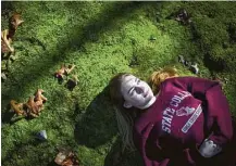  ?? Marie D. De Jesús / Houston Chronicle ?? Jade, 16, faces the afternoon light in the backyard of her home in State College, Pa. She and her family moved to Pennsylvan­ia after years of fighting for special education in Texas and being denied.