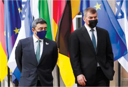  ?? ( Michele Tantussi/ Reuters) ?? UAE FOREIGN MINISTER Sheikh Abdullah bin Zayed al- Nahyan ( left) and his Israeli counterpar­t Gabi Ashkenazi greet as they visit the Holocaust memorial prior to their historic meeting in Berlin, this week.