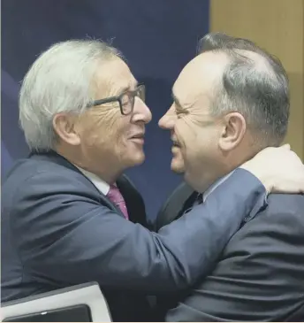  ??  ?? 0 European Commission President Jean-claude Juncker, left, greets MP and former First Minister of Scotland Alex Salmond prior to a meeting at EU headquarte­rs in Brussels.