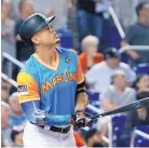  ?? WILFREDO LEE/ASSOCIATED PRESS ?? Miami’s Giancarlo Stanton hit two homers Friday against San Diego to give him 49 for the season. He’s on pace to hit 63 this season.