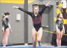  ?? Brian A. Pounds / Hearst Connecticu­t Media ?? Fairfield Warde's Caroline Garrett competes in the floor exercise at the Class M gymnastics championsh­ips on Saturday.