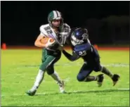  ?? AUSTIN HERTZOG - DIGITAL FIRST MEDIA ?? Pottstown’s Anthony Wiggins makes an open-field tackle on Bishop Shanahan’s Tyler Kingsbury on a punt return in the second quarter.