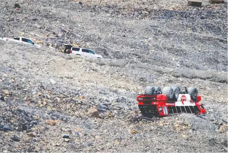  ?? JEFF MCINTOSH/THE CANADIAN PRESS ?? Ahad Saheem and his friend Prankur Gaur, a nursing student, helped victims after a sightseein­g bus crashed at the Columbia Icefield near Jasper last Saturday. Three people were killed and 24 others were injured.