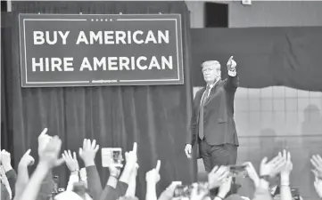  ??  ?? Trump greets supporters during a rally at the Van Andel Arena in Grand Rapids, Michigan. Trump’s move to lift bans on drilling for oil and gas in offshore Arctic and Atlantic areas is illegal, a US judge has ruled. — AFP photo