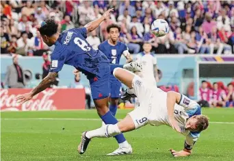 ?? Stu Forster/Getty Images ?? Weston McKennie of United States battles for possession with Harry Kane of England.