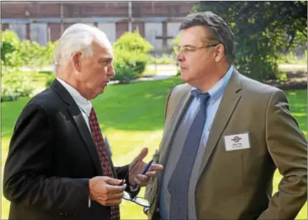  ?? PETE BANNAN - DIGITAL FIRST MEDIA ?? Jim DePetris of Legend Properties speaks Coatesvill­e City Manager Mike Trio about the Coatesvill­e project.