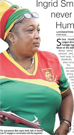  ??  ?? The ever-present Miss Ingrid Smith (left) of Humble Lion FC engages in conversati­on with the supporters.