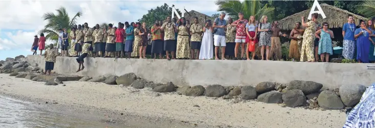  ??  ?? Guests and staff at Nanuya Island Resort in Yasawa Group.