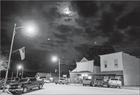  ?? NATI HARNIK/AP PHOTO ?? Cedar Street in the center of the village of Nickerson, Neb., is seen at night last month. When regional officials announced plans to open a $300 million chicken processing plant employing 1,100 workers, residents packed the firehall and the village board unanimousl­y voted against the plant, and a week later the company gave up, saying they’d take their plant and jobs elsewhere.