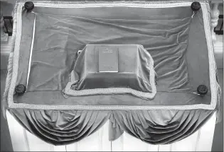  ??  ?? A “siddur” (prayer book) sits Thursday atop the “Bima” (reader’s deck) at the Touro Synagogue, the nation’s oldest, in Newport, R.I.