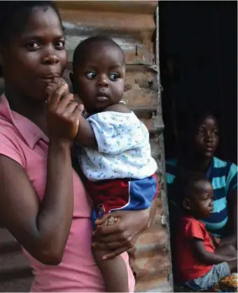  ??  ?? Teenage mothers are common in many parts of Africa