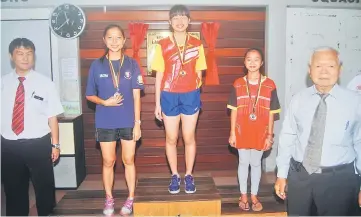  ??  ?? The winners in Girls’ U-18 category receive their medals. At right is Lau.