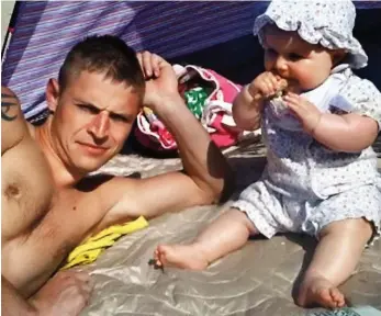  ??  ?? Family man: Adam Fenton on the beach with daughter Macie when she was a baby